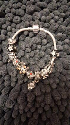 Srebrna narukvica 31 gr 10 privezaka