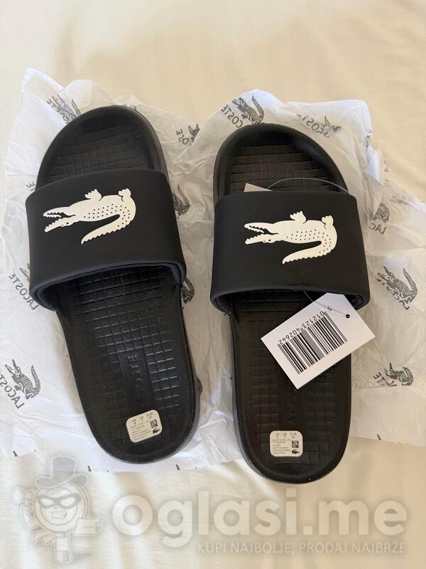 prodajem muske lacoste papuce u crnoj i beloj boji papuce su nove  broj 41-26cm moze licno preuzimanje u  beogradu ili slanje postom za vise informacija dm.